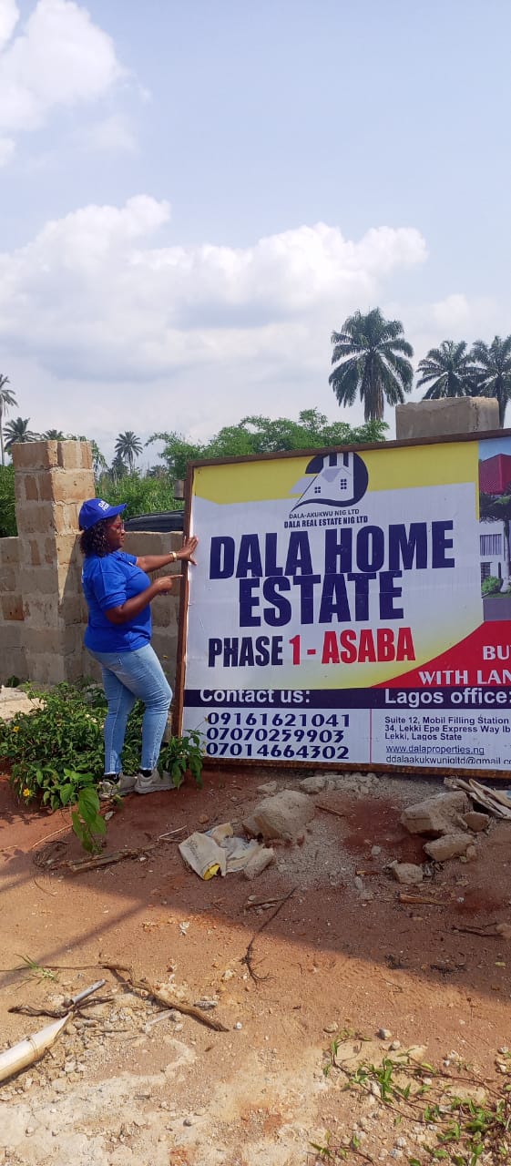 Dala Real Estate representative at the Asaba estate site