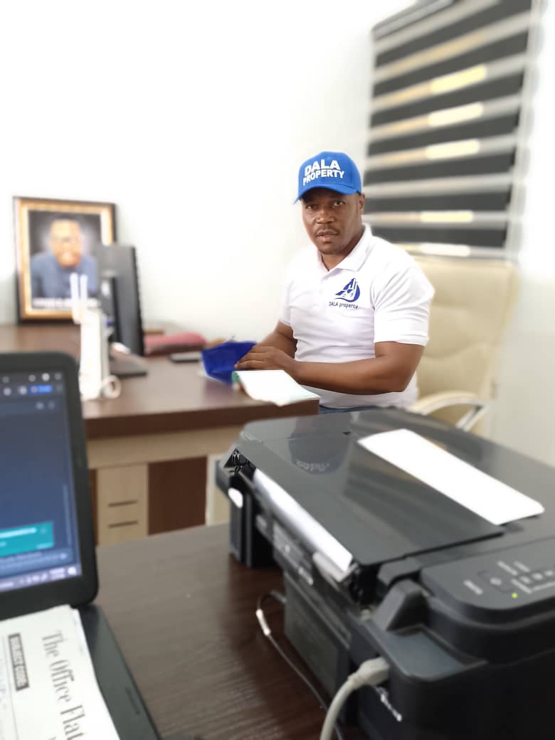 A Dala Real Estate representative working at the office